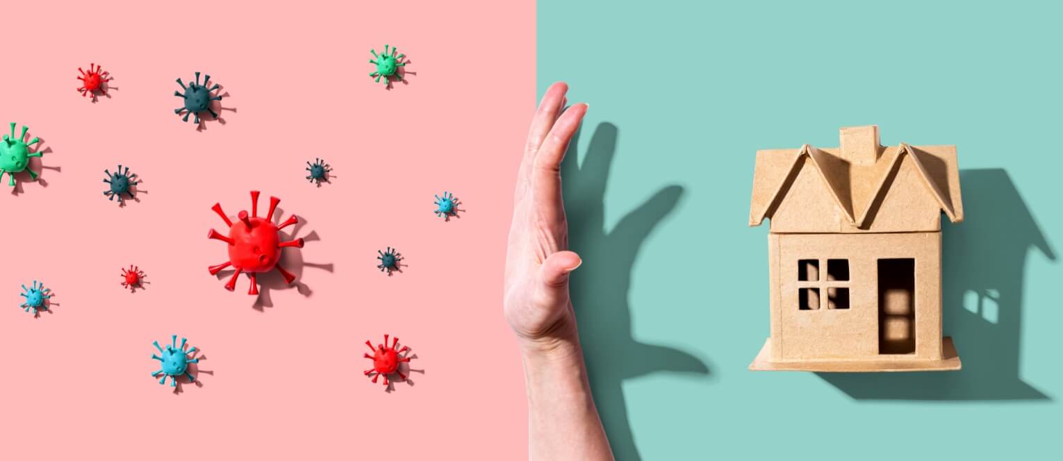 A hand reaching up to touch the wall with viruses on it.